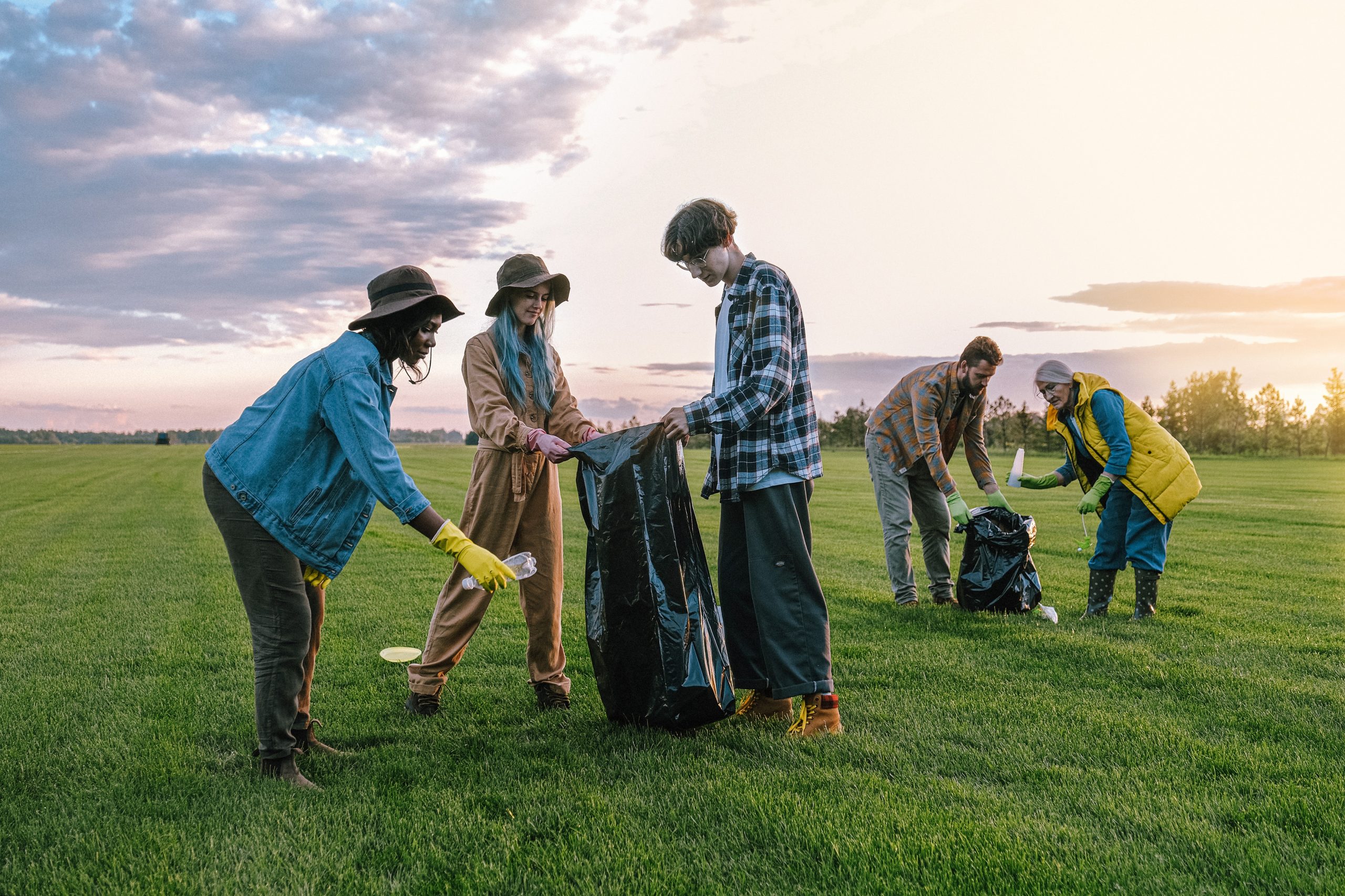 Volunteers cleaning up litter in a park
